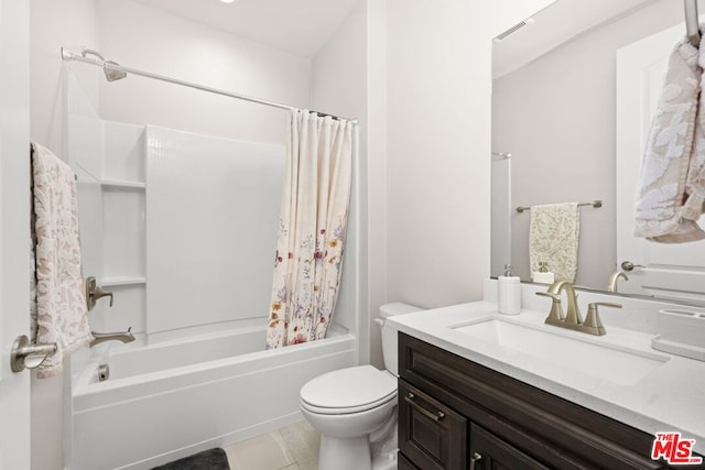 full bathroom featuring tile patterned flooring, shower / tub combo, vanity, and toilet