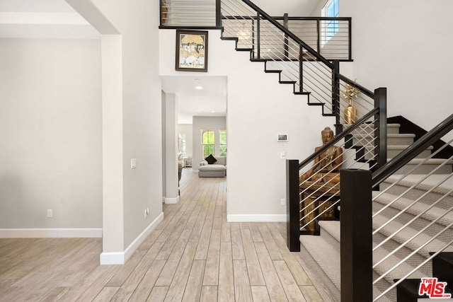 stairway featuring hardwood / wood-style flooring