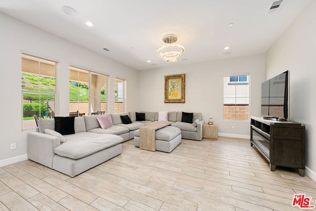 living room with light hardwood / wood-style floors