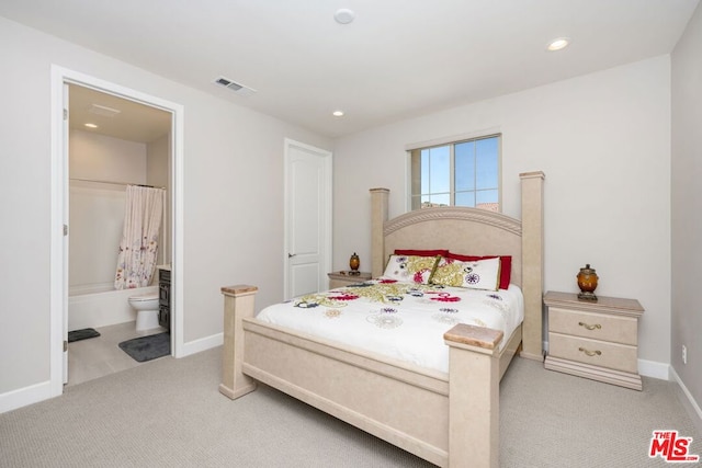 carpeted bedroom with ensuite bathroom