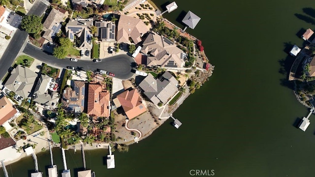 birds eye view of property featuring a water view and a residential view