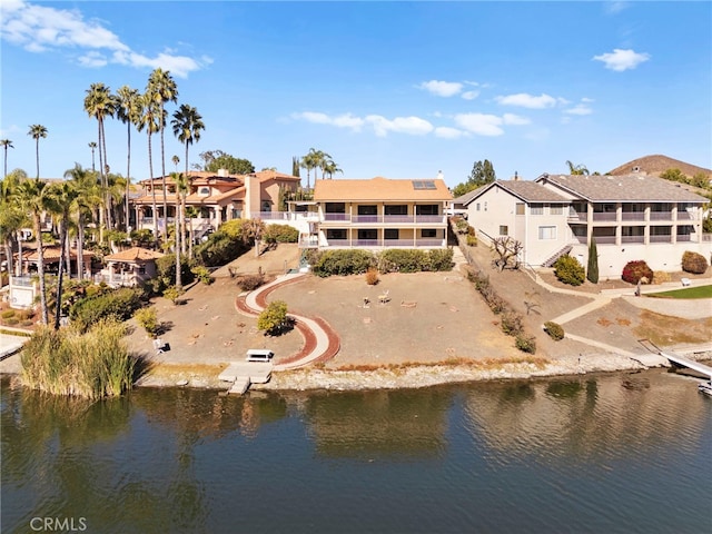 bird's eye view with a water view and a residential view