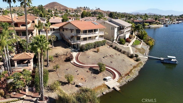 bird's eye view featuring a residential view and a water and mountain view