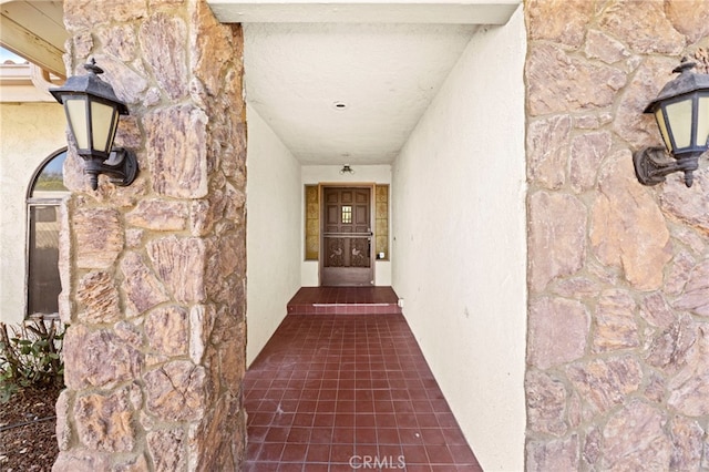 entrance to property with stucco siding