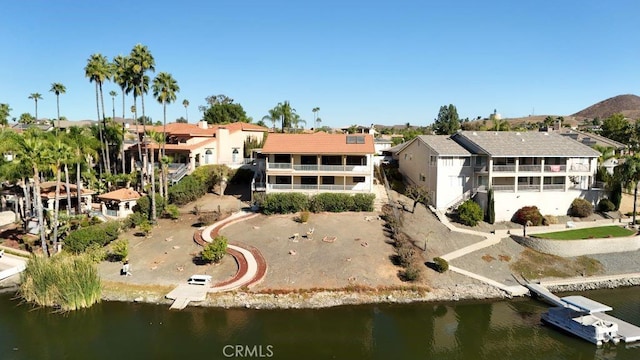 exterior space featuring a water view and a residential view