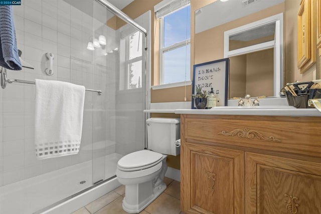 bathroom with walk in shower, tile patterned flooring, vanity, and toilet