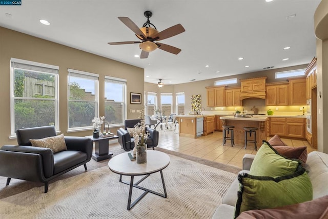 living room with ceiling fan and light tile patterned floors