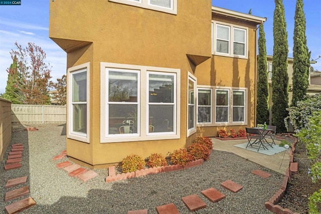 back of house featuring a patio