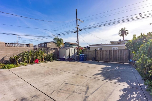 view of patio with a storage shed