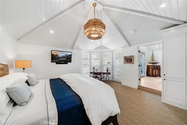 bedroom with vaulted ceiling with beams, light carpet, and baseboards