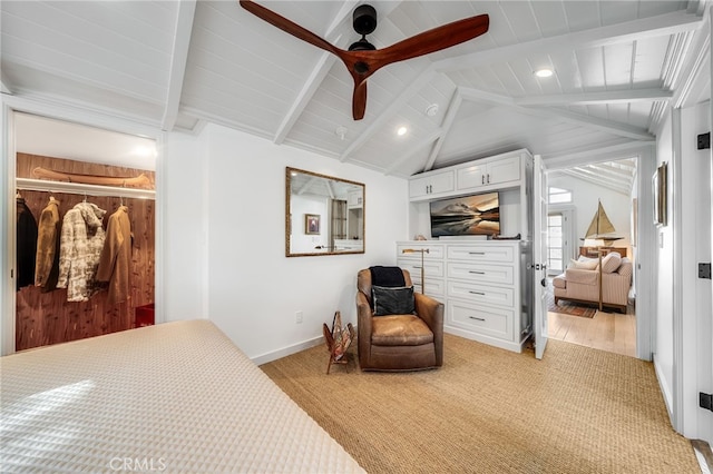 bedroom with a ceiling fan, wood ceiling, vaulted ceiling with beams, and baseboards