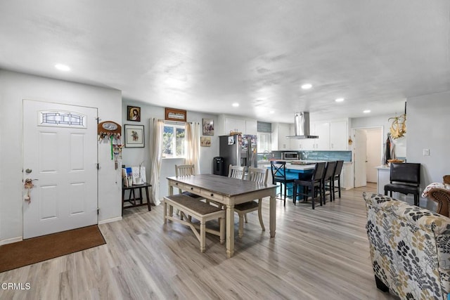 dining room with light hardwood / wood-style floors