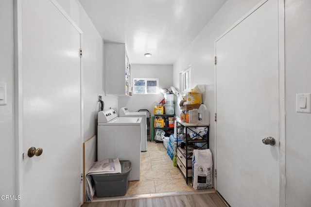 washroom featuring washer and dryer and light hardwood / wood-style flooring