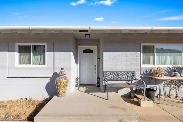 doorway to property featuring a patio area