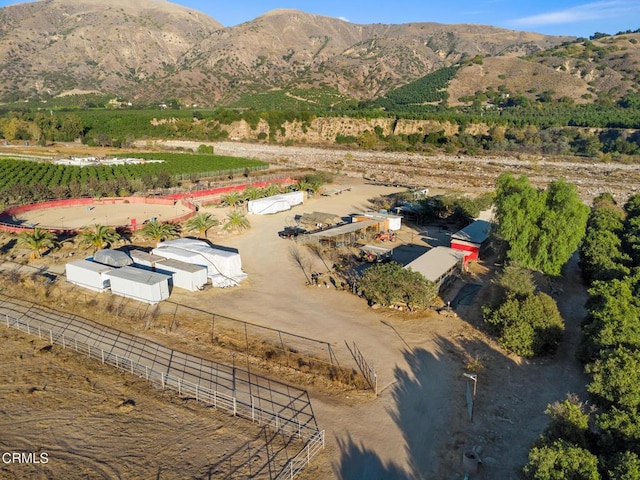 drone / aerial view with a mountain view and a rural view