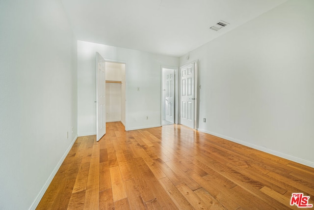 spare room featuring light hardwood / wood-style floors