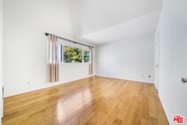 unfurnished room with light hardwood / wood-style floors