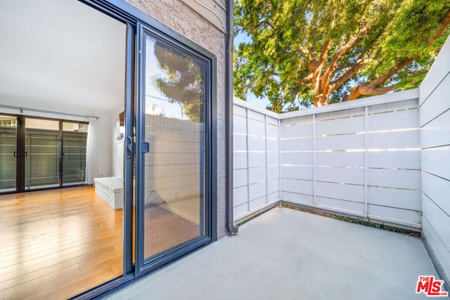 exterior space featuring hardwood / wood-style flooring