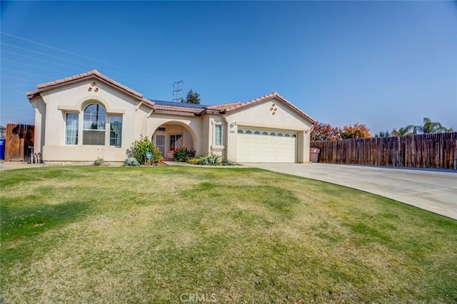 view of front of property with a garage and a front yard