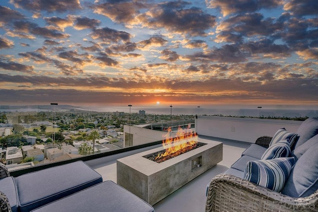 balcony at dusk with a fire pit