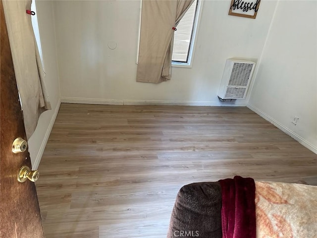 empty room with light hardwood / wood-style floors