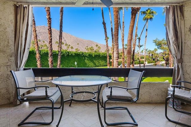 view of patio / terrace featuring a mountain view and a balcony