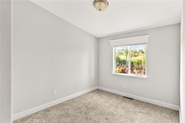 empty room with light colored carpet