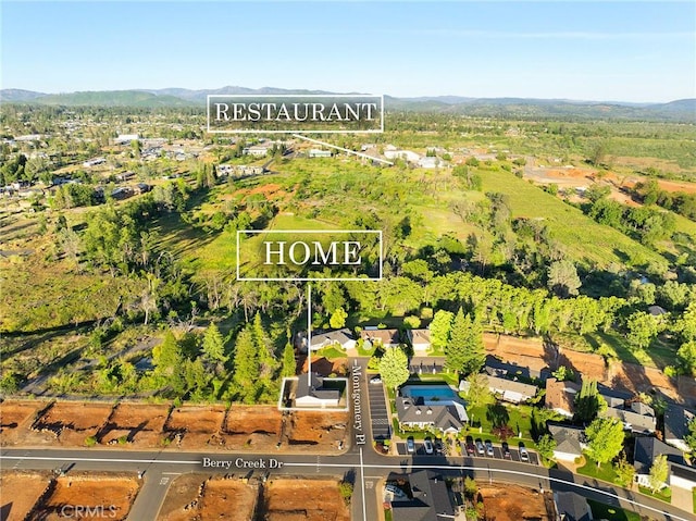 511 Montgomery, Paradise, CA 95969 - aerial perspective of suburban area with property boundaries highlighted and mountains
