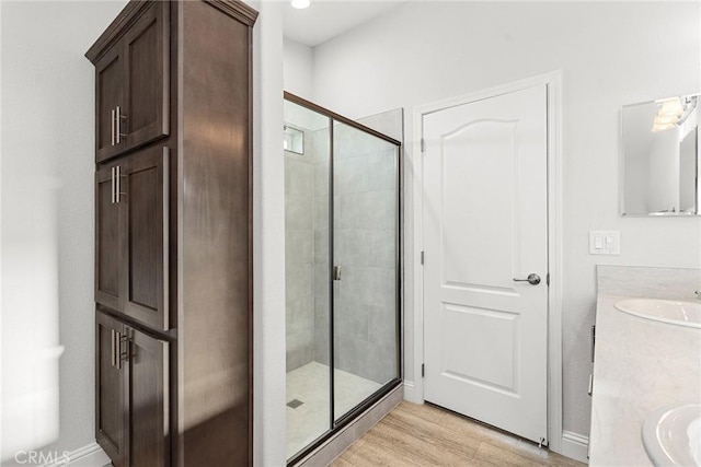 511 Montgomery, Paradise, CA 95969 - full bathroom featuring vanity, a shower stall, and wood finished floors