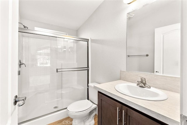 bathroom with toilet, an enclosed shower, lofted ceiling, and vanity