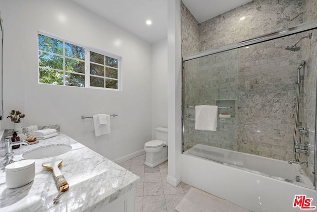 full bathroom with vanity, toilet, and enclosed tub / shower combo