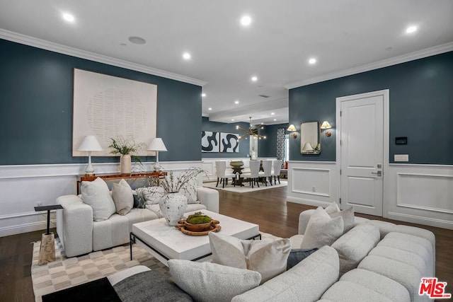 living room with hardwood / wood-style flooring and ornamental molding