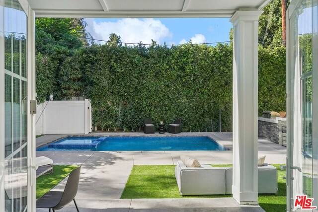 view of swimming pool featuring a patio