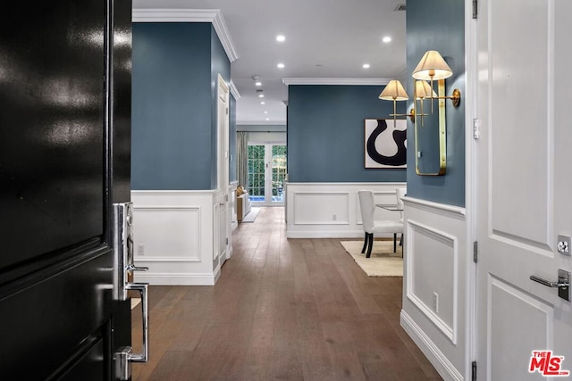 interior space featuring dark hardwood / wood-style flooring and ornamental molding