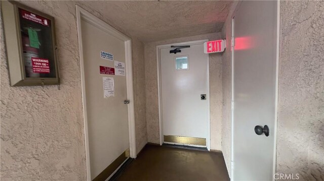 corridor with concrete flooring