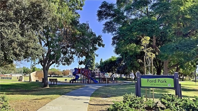 surrounding community with playground community and a lawn