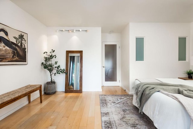 bedroom with hardwood / wood-style floors