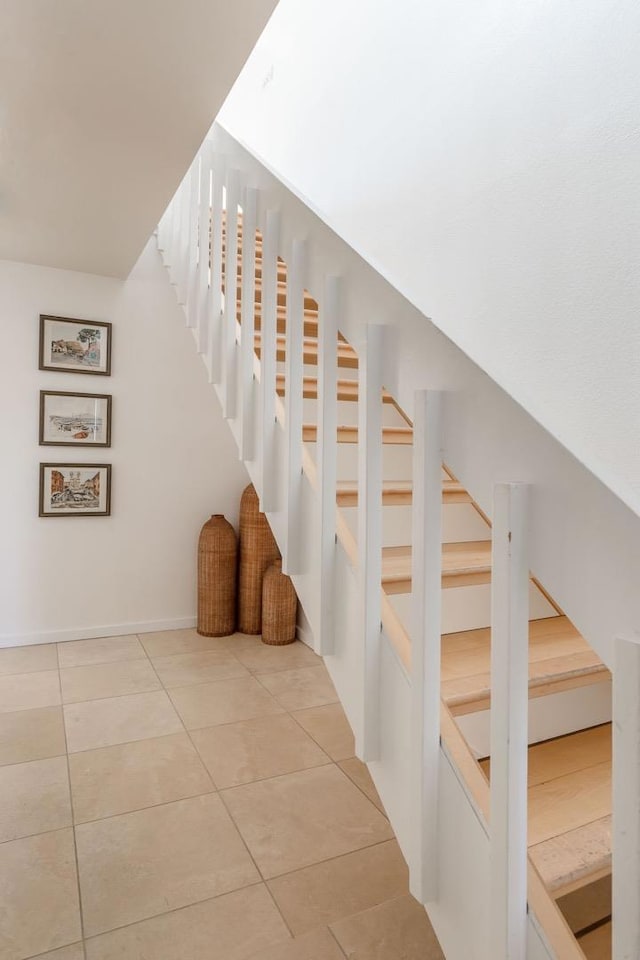 stairs with tile patterned flooring