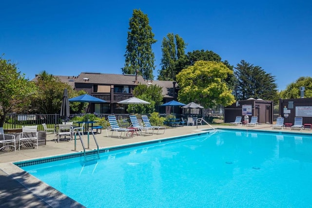 view of swimming pool with a patio