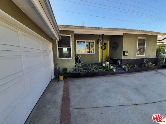 entrance to property featuring a garage