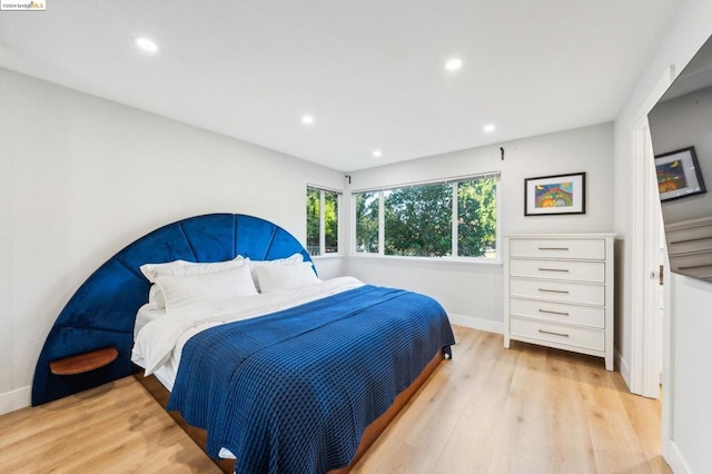 bedroom with light wood-type flooring