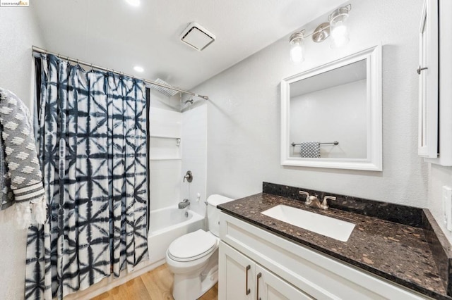 full bathroom with toilet, vanity, shower / bathtub combination with curtain, and hardwood / wood-style flooring