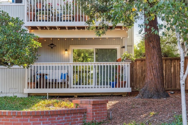 back of property with a balcony