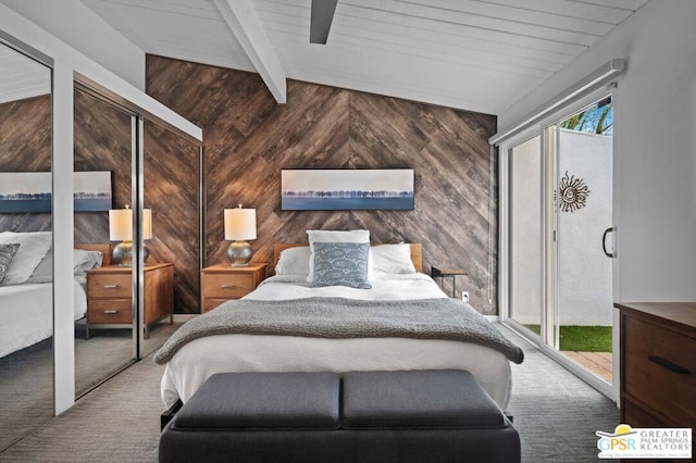 carpeted bedroom featuring access to outside, vaulted ceiling with beams, and wood walls