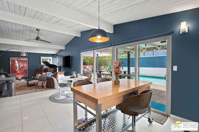 tiled dining space with vaulted ceiling with beams and ceiling fan