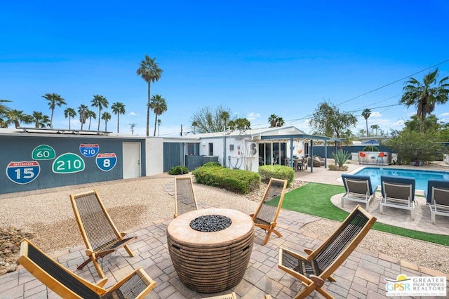 view of patio featuring a fire pit