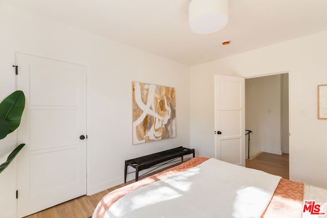 bedroom with light hardwood / wood-style floors