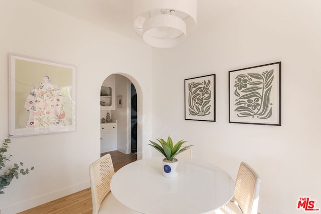 dining area with wood-type flooring