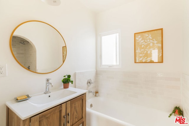 bathroom with vanity and a bathing tub