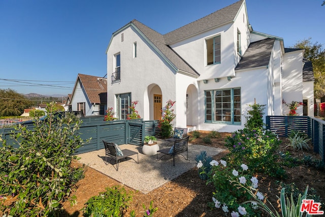 back of property with a patio area